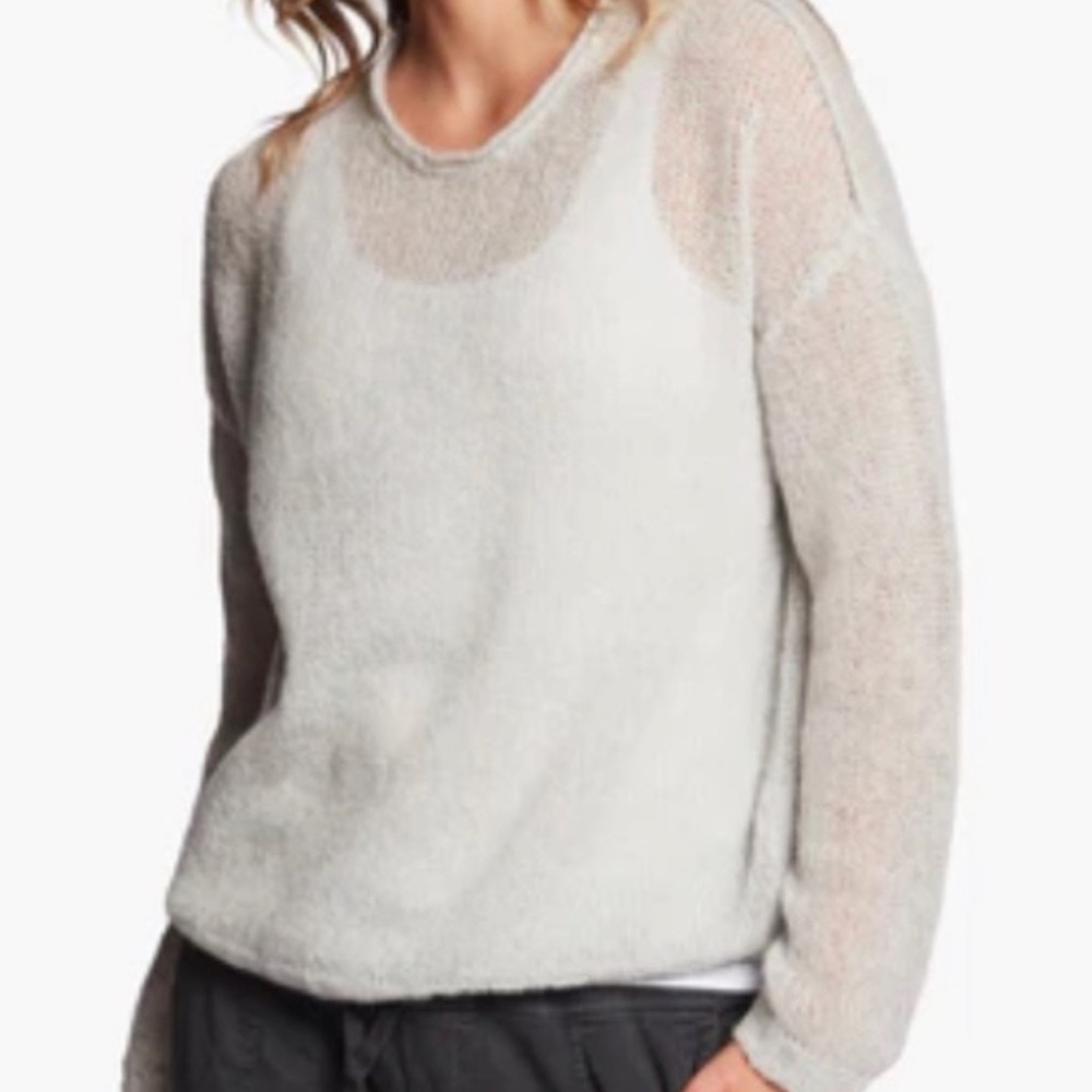Ivory color wool and cashmere open weave crewneck sweater.
